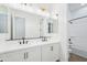 Bathroom featuring dual sinks, modern fixtures, and a tub with a shower at 22825 E Alyssa Rd, Queen Creek, AZ 85142