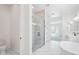 Bathroom featuring a glass shower, white subway tile, and hexagon tile flooring, blending style and function at 22825 E Alyssa Rd, Queen Creek, AZ 85142