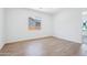 Bright, minimalist bedroom with tiled floors and natural light at 22825 E Alyssa Rd, Queen Creek, AZ 85142