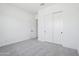 Cozy bedroom with carpet flooring and large closet with sliding doors at 22825 E Alyssa Rd, Queen Creek, AZ 85142