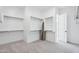 Walk-in closet featuring tiered shelving and carpeted floors, providing ample space for organization at 22825 E Alyssa Rd, Queen Creek, AZ 85142