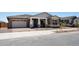 Inviting single-Gathering home features manicured gravel landscaping and a cozy, covered entrance at 22825 E Alyssa Rd, Queen Creek, AZ 85142