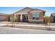 Inviting single-Gathering home features manicured gravel landscaping and a cozy, covered entrance at 22825 E Alyssa Rd, Queen Creek, AZ 85142