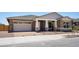 Inviting single-Gathering home features manicured gravel landscaping and a cozy, covered entrance at 22825 E Alyssa Rd, Queen Creek, AZ 85142