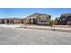 Inviting single-Gathering home features manicured gravel landscaping and a cozy, covered entrance at 22825 E Alyssa Rd, Queen Creek, AZ 85142