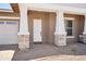 Inviting front porch features stone pillars and a brick walkway at 22825 E Alyssa Rd, Queen Creek, AZ 85142