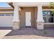 Inviting front porch features stone pillars and a brick walkway at 22825 E Alyssa Rd, Queen Creek, AZ 85142