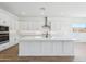 Modern kitchen with stainless steel appliances, white cabinetry, and a spacious island at 22825 E Alyssa Rd, Queen Creek, AZ 85142