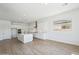 Gourmet kitchen boasts stainless steel appliances, a large island, and custom white cabinets at 22825 E Alyssa Rd, Queen Creek, AZ 85142