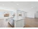 This spacious kitchen includes an island with a sink and dishwasher, as well as access to a sunny living area at 22825 E Alyssa Rd, Queen Creek, AZ 85142