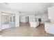Open-concept kitchen features white cabinetry, stainless steel appliances, and a center island with stone countertops at 22825 E Alyssa Rd, Queen Creek, AZ 85142
