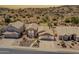 Expansive aerial view of a suburban home displaying a desert landscaped yard and neighborhood setting at 2333 E Taxidea Way, Phoenix, AZ 85048