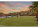 Spacious backyard with a pool, grassy area, desert plants, and a gazebo for outdoor enjoyment at 2333 E Taxidea Way, Phoenix, AZ 85048