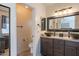 Bright bathroom featuring a granite countertop, dual basin sinks, and enclosed toilet at 2333 E Taxidea Way, Phoenix, AZ 85048