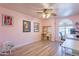 Home office/bedroom with light wood floors, natural light, and ceiling fan at 2333 E Taxidea Way, Phoenix, AZ 85048