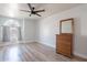Bedroom featuring hardwood flooring, natural light, and a classic wood dresser at 2333 E Taxidea Way, Phoenix, AZ 85048