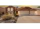 Charming two-story home showcasing a well-maintained front yard and a convenient two-car garage at 2333 E Taxidea Way, Phoenix, AZ 85048