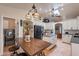 Bright kitchen with a skylight, an island, a breakfast table, and stainless steel appliances at 2333 E Taxidea Way, Phoenix, AZ 85048
