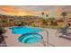 Relaxing pool and spa area with lounge chairs, desert landscaping, and a mountain view at 2333 E Taxidea Way, Phoenix, AZ 85048