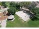 Aerial view of a community park featuring a basketball court, playground, and covered picnic area at 2397 E Winchester Pl, Chandler, AZ 85286