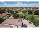 Aerial view showcasing tile roofed homes and lush landscaping in a well-planned community at 2397 E Winchester Pl, Chandler, AZ 85286