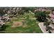 Aerial view of a green space running through a community with mature trees and well-maintained landscaping at 2397 E Winchester Pl, Chandler, AZ 85286