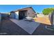 Spacious backyard featuring a covered patio, stamped concrete, and low-maintenance desert landscaping at 2397 E Winchester Pl, Chandler, AZ 85286