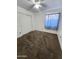 Bright bedroom with carpet flooring, a ceiling fan, and a closet with sliding doors at 2397 E Winchester Pl, Chandler, AZ 85286