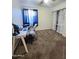 Bedroom featuring carpet, a ceiling fan, and a desk with workspace at 2397 E Winchester Pl, Chandler, AZ 85286