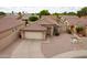 Charming single-Gathering home with a tile roof, two-car garage, and desert landscaping at 2397 E Winchester Pl, Chandler, AZ 85286