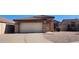 Inviting single-level home featuring a neutral color scheme, two-car garage, and easy-care landscaping at 2397 E Winchester Pl, Chandler, AZ 85286