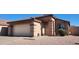Charming single-story home with a well-maintained front yard and a two-car garage at 2397 E Winchester Pl, Chandler, AZ 85286