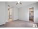 Spacious bedroom with neutral walls, carpet flooring, and a ceiling fan at 2644 S Dock St, Gilbert, AZ 85295