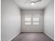 Bedroom features a window with blinds and a ceiling fan at 2644 S Dock St, Gilbert, AZ 85295