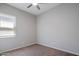 Cozy bedroom with neutral walls, carpet flooring, and a window at 2644 S Dock St, Gilbert, AZ 85295
