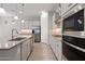 Spacious kitchen with stainless steel appliances, modern cabinets, and a large island at 2644 S Dock St, Gilbert, AZ 85295