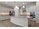Well-equipped kitchen with modern stainless steel appliances, stylish cabinets, and an island at 2644 S Dock St, Gilbert, AZ 85295