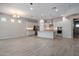 Expansive living space features tile floors and flows seamlessly into the modern kitchen at 2644 S Dock St, Gilbert, AZ 85295