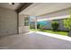 Covered patio area with decorative sun shades and artificial turf at 2644 S Dock St, Gilbert, AZ 85295