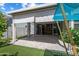 Covered patio with retractable sun shades and view of the well-maintained backyard at 2644 S Dock St, Gilbert, AZ 85295