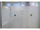 Modern bathroom shower with tiled walls and multi-setting shower head at 2644 S Dock St, Gilbert, AZ 85295