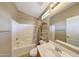 Well-lit bathroom with a shower-over-tub and a single sink vanity at 2725 E Mine Creek Rd # 2058, Phoenix, AZ 85024