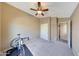 Cozy bedroom with neutral carpeting, a ceiling fan, and a closet at 2725 E Mine Creek Rd # 2058, Phoenix, AZ 85024