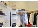 Organized walk-in closet features shelving and hanging storage for clothing and accessories at 2725 E Mine Creek Rd # 2058, Phoenix, AZ 85024
