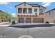Three-story home with three-car garage, balcony, and desert landscaping at 2725 E Mine Creek Rd # 2058, Phoenix, AZ 85024