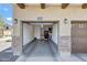 Attached two-car garage with painted walls and ample room for parking and storage at 2725 E Mine Creek Rd # 2058, Phoenix, AZ 85024