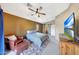 Main bedroom with ensuite bathroom, natural light, modern ceiling fan and a barn door at 2725 E Mine Creek Rd # 2058, Phoenix, AZ 85024