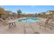 Relaxing pool area with lounge chairs and shaded picnic pavilions in a well-maintained community at 2725 E Mine Creek Rd # 2058, Phoenix, AZ 85024