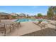 Community pool with lounge chairs and shaded seating areas at 2725 E Mine Creek Rd # 2058, Phoenix, AZ 85024