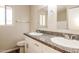 The bathroom features a double sink with granite countertops and neutral-colored walls at 3045 W Palmaire Ave, Phoenix, AZ 85051